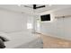 Bright bedroom with natural light, light hardwood floors, ceiling fan, and access to the backyard at 3009 Rockingham Sw Ct, Concord, NC 28025