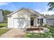 Inviting single-Gathering home boasts a well-maintained lawn, attached garage, and a welcoming entrance at 3009 Rockingham Sw Ct, Concord, NC 28025