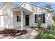 Close-up of a well-maintained home, showcasing the front door, manicured landscaping, and exterior features at 3009 Rockingham Sw Ct, Concord, NC 28025