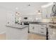Open kitchen with granite countertops, island, stainless steel appliances, and seamless flow to the living area at 3009 Rockingham Sw Ct, Concord, NC 28025