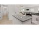 This kitchen features stainless steel appliances, granite countertops, and seamlessly connects to the living room at 3009 Rockingham Sw Ct, Concord, NC 28025
