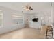 Bright living area with hardwood floors, a ceiling fan, and a well-lit, airy atmosphere at 3009 Rockingham Sw Ct, Concord, NC 28025