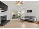 Bright living room boasts fireplace, recessed lighting, and sliding glass door leading to outdoor space at 3009 Rockingham Sw Ct, Concord, NC 28025