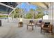 Covered patio featuring an outdoor seating area with modern furniture, a fire pit, and a spacious seating area at 3009 Rockingham Sw Ct, Concord, NC 28025