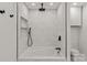Bathroom shower with marble tiling, rainfall shower head, and modern fixtures at 3009 Rockingham Sw Ct, Concord, NC 28025