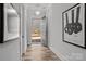 Welcoming foyer with hardwood floors, light walls, and a view to the front yard at 302 Ambleside Village Ln, Davidson, NC 28036