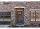 Close up of the stone work around the front door of this charming house at 302 Ambleside Village Ln, Davidson, NC 28036