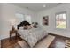 Bright bedroom featuring hardwood floors, neutral walls, and ample natural light at 324 Westwood Ave, Charlotte, NC 28203