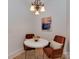 Cozy dining area with modern chandelier, round table, and two comfortable chairs at 324 Westwood Ave, Charlotte, NC 28203