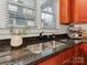 Gourmet kitchen featuring stainless steel sink, dark granite countertops, and modern espresso machine at 324 Westwood Ave, Charlotte, NC 28203