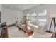 Sunlit living room with modern furnishings, large windows, and a cozy atmosphere at 324 Westwood Ave, Charlotte, NC 28203