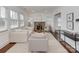 Bright living room featuring a decorative fireplace, large windows, and comfortable seating arrangement at 324 Westwood Ave, Charlotte, NC 28203