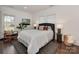 Stylish bedroom features a large bed, hardwood floors, and ample natural light at 324 Westwood Ave, Charlotte, NC 28203