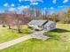 Charming ranch home with long driveway and lush, green lawn at 341 Massey Deal Rd, Statesville, NC 28625