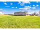 Home exterior with a large, grassy backyard and wooden deck at 341 Massey Deal Rd, Statesville, NC 28625