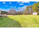 Spacious backyard with a wooden storage shed at 341 Massey Deal Rd, Statesville, NC 28625