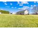Home exterior showcasing a large, grassy backyard at 341 Massey Deal Rd, Statesville, NC 28625