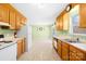 Open kitchen layout with classic wood cabinetry and bright natural light at 341 Massey Deal Rd, Statesville, NC 28625
