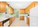 Traditional kitchen with wood cabinets, white countertops, and tiled flooring at 341 Massey Deal Rd, Statesville, NC 28625