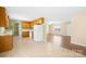 Eat-in kitchen features wood cabinets, tile floors, and white appliances at 341 Massey Deal Rd, Statesville, NC 28625