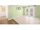 Bright sunroom featuring tile flooring and french doors at 341 Massey Deal Rd, Statesville, NC 28625