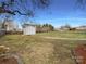 A backyard featuring a shed with a path that leads to the structure at 3632 Farm Lake Sw Dr, Concord, NC 28027