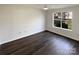 The bedroom has hardwood floors and a modern ceiling fan at 3632 Farm Lake Sw Dr, Concord, NC 28027