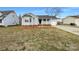 Charming single Gathering home featuring a cozy front porch and manicured lawn at 3632 Farm Lake Sw Dr, Concord, NC 28027