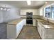 The eat-in kitchen is equipped with stainless steel appliances and granite countertops at 3632 Farm Lake Sw Dr, Concord, NC 28027