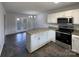 Eat-in kitchen featuring stainless steel appliances and granite countertops at 3632 Farm Lake Sw Dr, Concord, NC 28027