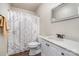 Well-lit bathroom featuring a shower with curtain, toilet and modern vanity at 430 Cress School Rd, Salisbury, NC 28147