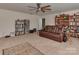 Featuring a ceiling fan and large window, this flex room provides ample space for a comfortable entertainment or recreation area at 4856 Pepper Dr, Harrisburg, NC 28075