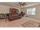 Equipped with a ceiling fan and large window, this flex room is designed for comfortable relaxation or hobbies at 4856 Pepper Dr, Harrisburg, NC 28075