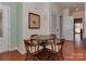 Cozy dining area with a round table, comfortable seating, and hardwood floors at 4856 Pepper Dr, Harrisburg, NC 28075
