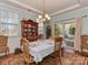 Charming dining room with natural light, set table, and convenient access to the outdoor patio at 4856 Pepper Dr, Harrisburg, NC 28075