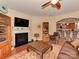 Inviting living room with a fireplace, hardwood floors, and open access to the dining and kitchen areas at 4856 Pepper Dr, Harrisburg, NC 28075