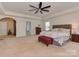 Spacious primary bedroom with a seating area, a queen bed, and plush carpet at 4856 Pepper Dr, Harrisburg, NC 28075