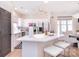 Contemporary kitchen with a central island, stylish lighting, and modern appliances at 4860 S Hill View Dr, Charlotte, NC 28210