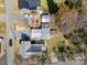 An aerial view showcases the home's layout, surrounding greenery, and proximity to neighboring properties at 520 Rogers St, Albemarle, NC 28001