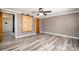 Bedroom with light gray walls, wood-look floors, and a sliding barn wood closet door at 520 Rogers St, Albemarle, NC 28001