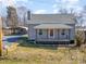 Charming home with gravel driveway and additional building perfect for storage or workspace at 520 Rogers St, Albemarle, NC 28001