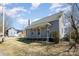 Quaint home featuring a covered front porch, charming architectural details, and mature trees at 520 Rogers St, Albemarle, NC 28001