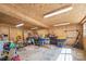 Spacious garage with plywood walls, concrete floors, and ample lighting for storage or projects at 520 Rogers St, Albemarle, NC 28001