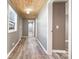 Bright hallway with light gray walls, wood-look floors, and a striking wood plank ceiling at 520 Rogers St, Albemarle, NC 28001