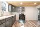 Modern kitchen with gray cabinets, quartz countertops, and stainless steel appliances at 520 Rogers St, Albemarle, NC 28001