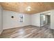 Inviting living room featuring stylish wood-look floors, modern wall colors, and plenty of natural light at 520 Rogers St, Albemarle, NC 28001