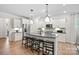 Modern kitchen with island seating, stainless steel appliances, and sleek cabinetry at 5220 Hatcher Creek Rd # 56, Charlotte, NC 28215
