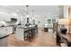 Open-concept kitchen with an island and seating flowing into the living area at 5220 Hatcher Creek Rd # 56, Charlotte, NC 28215
