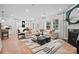 Spacious living room with a fireplace, ample seating, and plenty of natural light at 5220 Hatcher Creek Rd # 56, Charlotte, NC 28215
