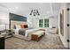 Serene main bedroom suite featuring a tray ceiling, a sitting area, and a large window at 5220 Hatcher Creek Rd # 56, Charlotte, NC 28215